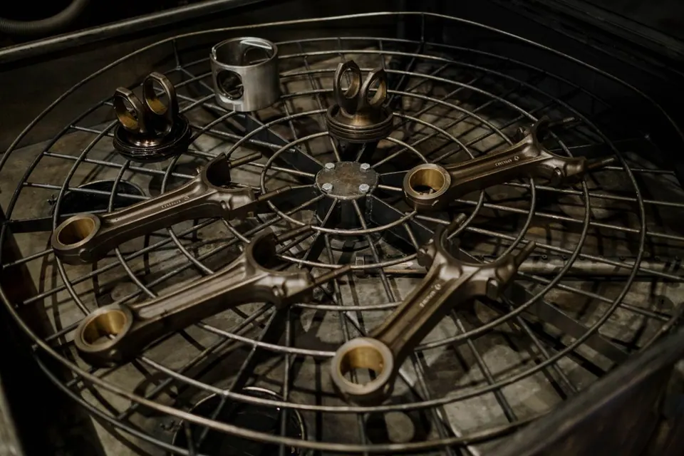 Engine components arranged on a metal rack
