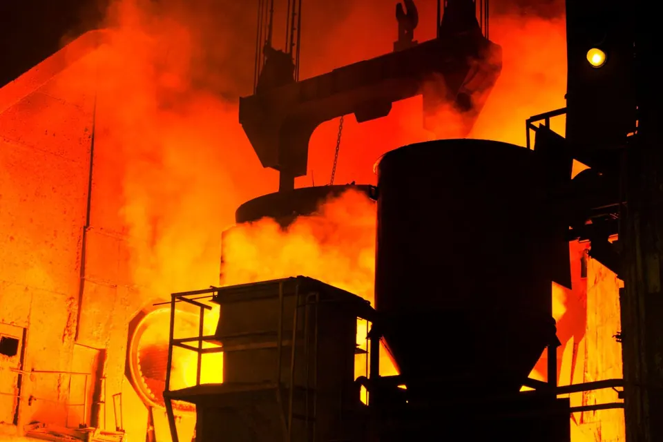 Molten metal being cast in a steel mill